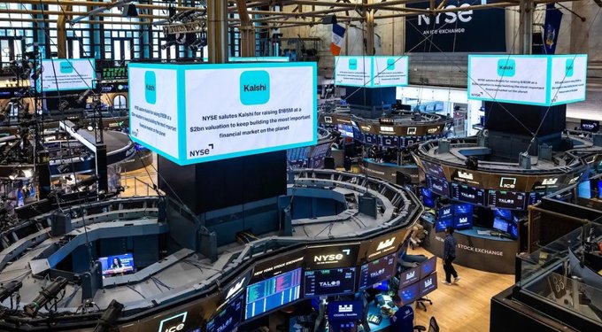 The interior of the New York Stock Exchange trading floor, featuring digital displays showing that NYSE salutes Kaishi for raising $188M at a $2B valuation.