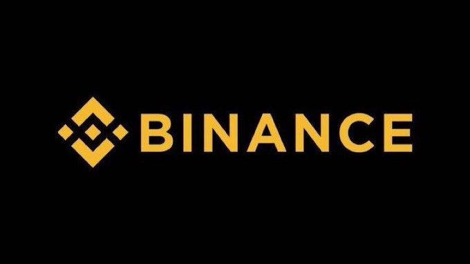 The image displays the Binance logo in gold lettering on a black background, visually representing the cryptocurrency exchange featured in the breaking news about its record $1.63 trillion futures trading volume in June 2026.