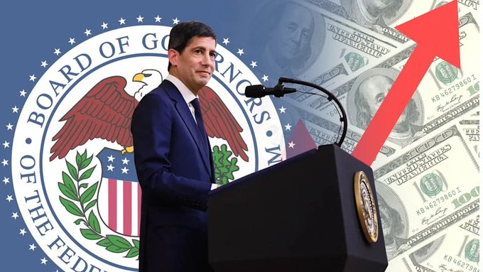 Composite image showing Federal Reserve Chairman Jerome Powell at a podium, overlaid with the Federal Reserve seal and a background of US hundred-dollar bills with a red upward-pointing arrow.