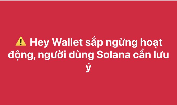A red warning banner with a yellow caution icon and text in Vietnamese: 'Hey Wallet sắp ngừng hoạt động, người dùng Solana cần lưu ý'.