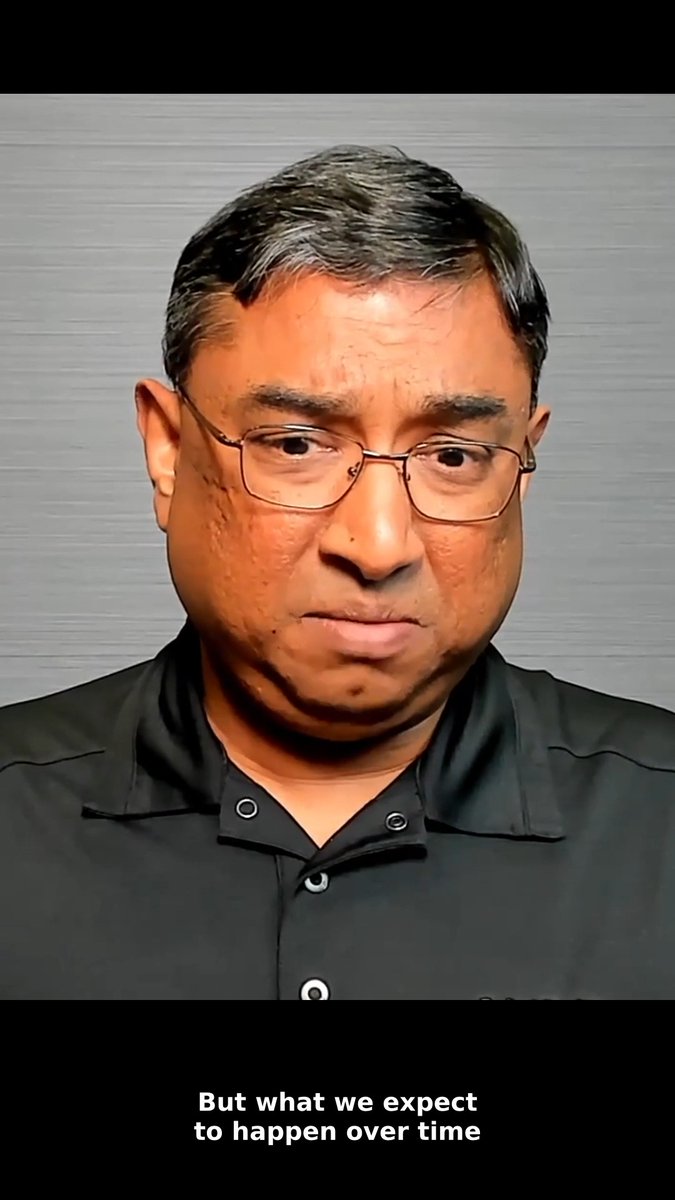 A man with glasses and a dark polo shirt appears in the video, with subtitles reading "But what we expect to happen over time," discussing how increased GPU token generation requires more CPU resources, as explained by AMD's Madhu R.