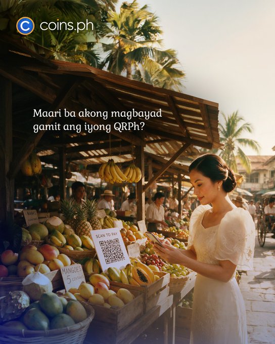 A woman in a white dress uses her phone to scan a QR code at a vibrant Filipino fruit market, with the text "Maari ba akong magbayad gamit ang iyong QRPh?" (Can I pay using your QRPh?) displayed above baskets of mangoes, pineapples, and bananas—promoting Coins.ph's QRPh payment feature.