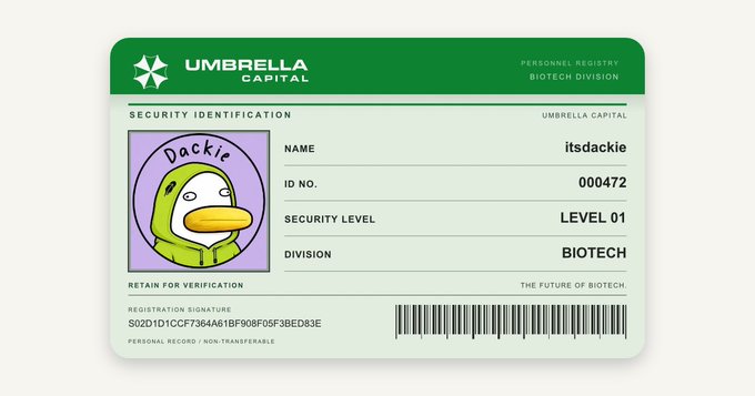 A digital ID card for 'Umbrella Capital' Biotech Division featuring the cartoon duck 'Dackie,' with username 'itsdackie,' ID No. 000472, and Security Level 01.