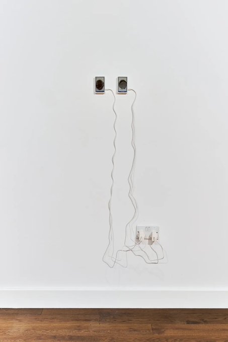 This image depicts the technical setup for Anna Ridler's artwork "Blooms of the Moon's 'Chelsea Bridge'," featuring two circular components connected by wires to a wall socket. This artwork, part of the [aside] series, is now entering the Centre Pompidou's permanent collection.