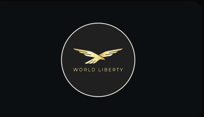 The image features a logo for a cryptocurrency called "World Liberty" that is displayed against a black background with gold accents. The logo consists of a circle containing an eagle inside, which is positioned above the word "WORLD". The text "WORLD LITERACY" is written below the eagle in white letters. The image also includes some text that reads "I didn't expect USD1 to become this big. few months ago whenever WLFI came up most of the discussion was about the token or the people behind the project. Now, focus on what is in the image and how it relates to the post."