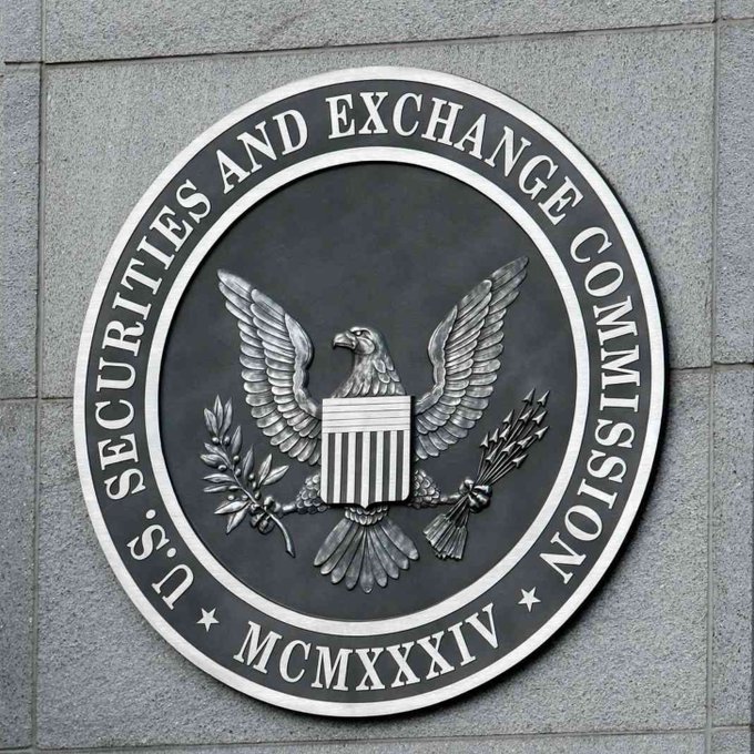The image shows the official metallic seal of the **U.S. Securities and Exchange Commission (SEC)**, inscribed with "MCMXXXIV" (1934) and featuring a bald eagle emblem with a shield, olive branch, and arrows. This seal visually anchors the post's announcement that **Injective ($INJ)** has become the first Layer 1 blockchain registered with the SEC as a transfer agent for real-world asset (RWA) issuance and recordkeeping.