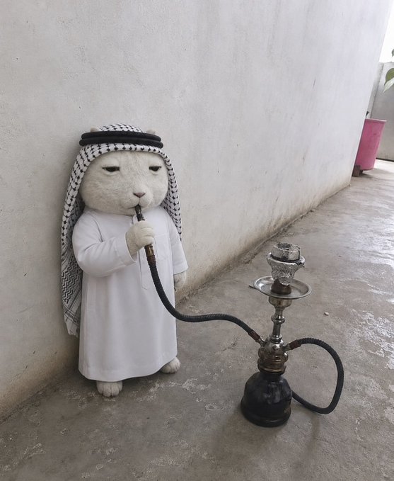 A plush white rat character dressed in traditional Arab clothing is posed smoking from a hookah. The image humorously illustrates the accompanying post "price no problem habibi $KET," playfully implying the character's high-status or "wealthy" persona.