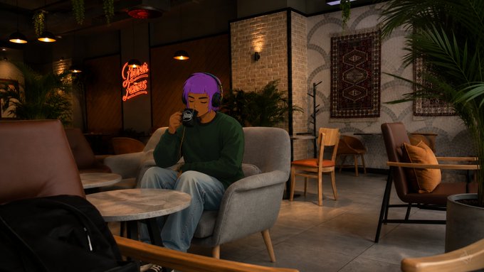 A person with purple hair wearing a green sweater and headphones sits in a gray armchair drinking from a mug in a lounge decorated with rugs and plants.