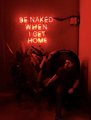 A dark, reddish-toned album cover with the text 'BE NAKED BE HONEST BE HUMBLE' showing a figure embracing another.