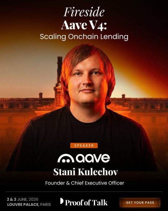 The image features a man with red hair wearing a black shirt, standing against an orange background that looks like a sunset or sunrise. The text "Fireside Aave V4: Scaling onchain lending" can be seen in the image as well. The man is smiling and appears to be giving a speech at an event.