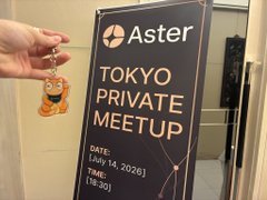 A hand holds up a small cute character keychain in front of a black signage display for the "Aster" "TOKYO PRIVATE MEETUP," held on July 18, 2026, from 6:30 PM, providing a cheerful visual to accompany the post about attending the lively event alongside many attendees from Korea and China.