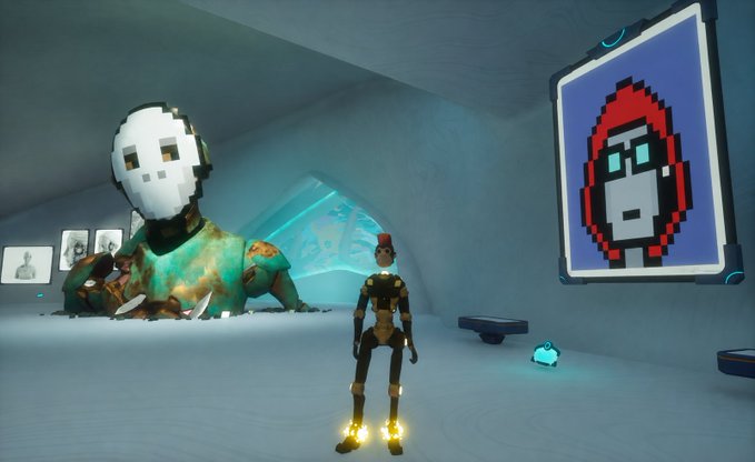 A video game scene featuring a robotic character standing before a large white mask statue and a pixelated red-hooded figure displayed on a screen.