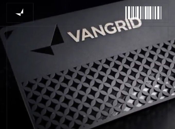 A close-up, angled view of a metallic silver surface featuring a repeating circular pattern, with the word "VANGRID" and a small logo embossed near the top edge.