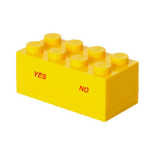 A yellow LEGO brick featuring eight studs on top and the words 'YES' and 'NO' printed in red on its side.