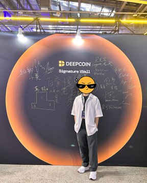A person wearing a white shirt, black pants, and pixelated sunglasses stands in front of a "DEEPCOIN" "Signature Wall" featuring an orange eclipse design.