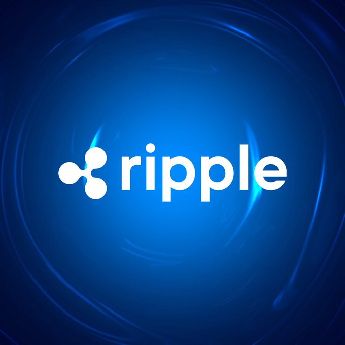 The white Ripple (XRP) cryptocurrency logo displayed against a dark blue, swirling, glowing background.