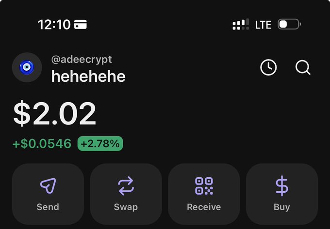 A screenshot of a crypto wallet showing a balance of just $2.02 worth of tokens under the account "@adeecrypt" nicknamed "hehehehe," with the post playfully challenging users to share their Solana address if $2 isn't a small amount to them.