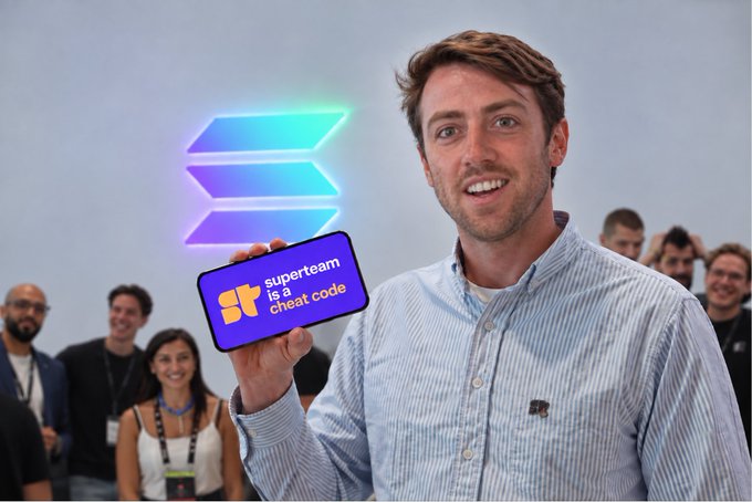 A man in a blue striped shirt holding a purple card that reads 'superteam is a cheat code' in front of a glowing Solana logo, with other people visible in the background.