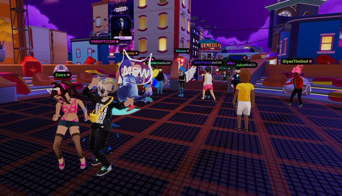 A screenshot from a Roblox virtual environment, showing various player avatars in a stylized, cartoonish town square with neon signs and buildings labeled 'PANDITICION' and 'GENESIS' under a purple sky.