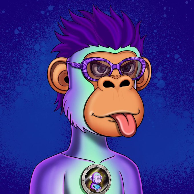 The image features a cartoon monkey wearing glasses, sunglasses, and a necklace with a small silver pendant. The monkey has its tongue sticking out playfully. The background of the image is blue, which complements the purple hair of the monkey character. The caption at the bottom of the image reads "Now! This is one of the cleanest @LunardollzNft I have seen! Got a baby like mine! Gave to the community and they gave back!! Never fade cant wait to stake for life!".