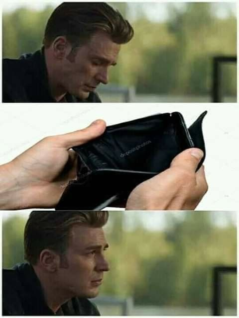 A man (appearing to be Captain America/Steve Rogers) looks down solemnly at an empty wallet, with the caption "dr-jones@arton" visible on the interior, before looking up with a resigned expression—capturing the financial exhaustion that perfectly fits the post's "2026 is not for the weak" sentiment.