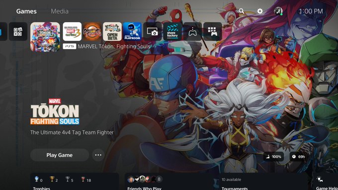 A PlayStation home screen displays the game selection menu at 1:00 PM, prominently featuring "MARVEL TOKON Fighting Souls - The Ultimate 4v4 Tag Team Fighter" with a "Play Game" button. The "69h" time shown in the bottom right relates to the post's mention of "69 productive hours," suggesting the user spent that long playing this newly released Marvel fighting game.