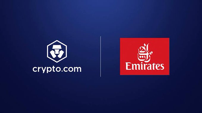 The image displays the Crypto.com and Emirates logos side by side on a dark blue background, visually representing the partnership announced in the post, which marks Emirates' integration of Crypto.com Pay for flight bookings in the UAE.