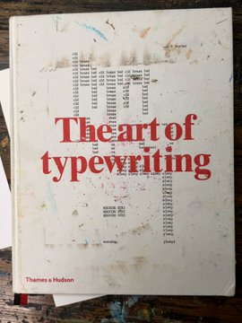 A book cover titled "The art of typewriting" published by Thames & Hudson, featuring a weathered white background with typewriter-style punched holes.