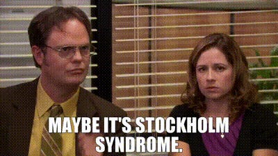 A still from The Office featuring Dwight and Pam with a caption reading 'MAYBE IT'S STOCKHOLM SYNDROME.'