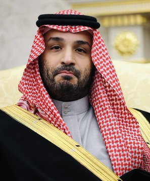 The image shows Mohammed bin Salman (MBS), the Crown Prince of Saudi Arabia, wearing traditional Saudi attire including a red and white checkered keffiyeh and a black agal, set against an ornate gold-embellished background. The caption likely relates to the post by depicting the Saudi leader who has reportedly aligned with Trump regarding withdrawal from the Chinese-led digital currency system and cooperation against the Houthis.