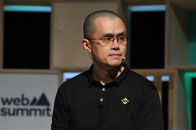 Changpeng Zhao (CZ), the founder of Binance (identifiable by the logo on his black polo shirt and the "web summit" text in the background), speaks on stage at a Web Summit event. His appearance relates to the post as he is the figure quoted advocating that crypto exchanges have become safer than self-custody for most users.