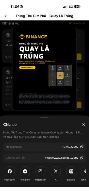 A mobile screen displays a Binance promotion titled 'MỪNG TẾT TRUNG THU - QUAY LÀ TRÚNG' (Mid-Autumn Festival Lucky Draw), offering a chance to win an iPhone 18 Pro and a share prize pool of 100,000 USDT.