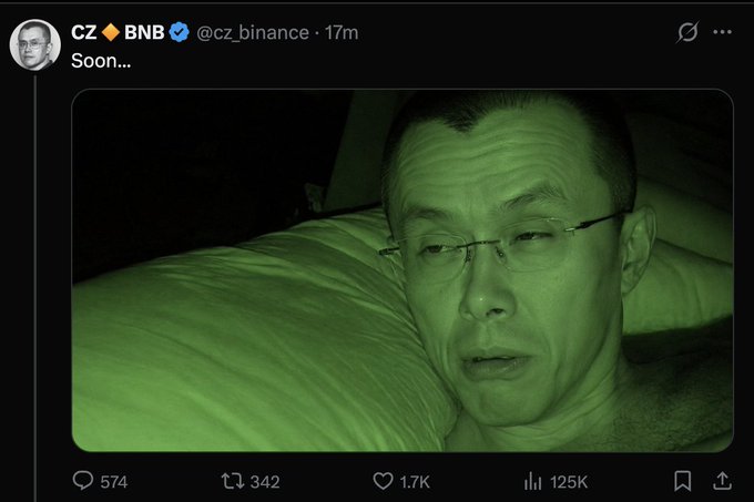 A tweet from @cz_binance displays a green-tinted, close-up selfie of CZ lying on a pillow, captioned simply "Soon..." — posted shortly after, accumulating 125K views, 1.7K likes, and 342 retweets within 17 minutes.