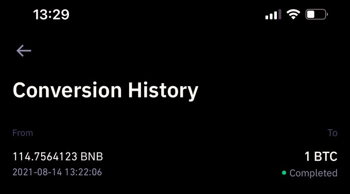 A mobile screenshot of a 'Conversion History' page showing a completed transaction of '114.7564123 BNB' to '1 BTC' dated '2021-08-14 13:22:06' on a dark background.