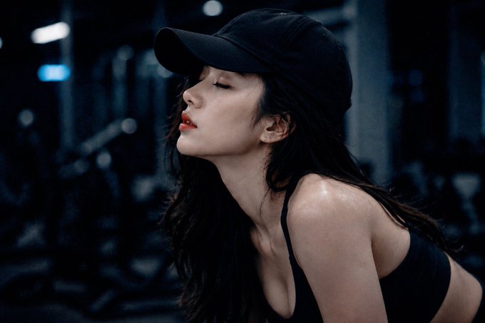 A woman in a black cap and tank top is shown in a gym setting, with her eyes closed in a moment of focused determination after a workout. The image complements the motivational message about persistence and creating value on 𝕏, visually symbolizing the discipline and consistent effort required to succeed.