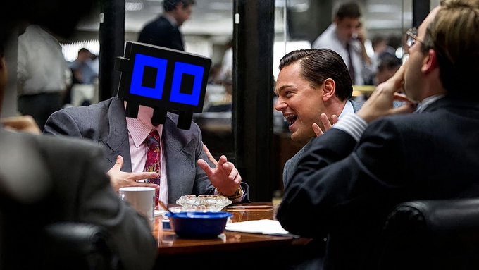 A scene from 'The Wolf of Wall Street' shows Leonardo DiCaprio laughing animatedly across from a colleague whose head has been replaced with a digital pixelated face, set in a busy office dining area.
