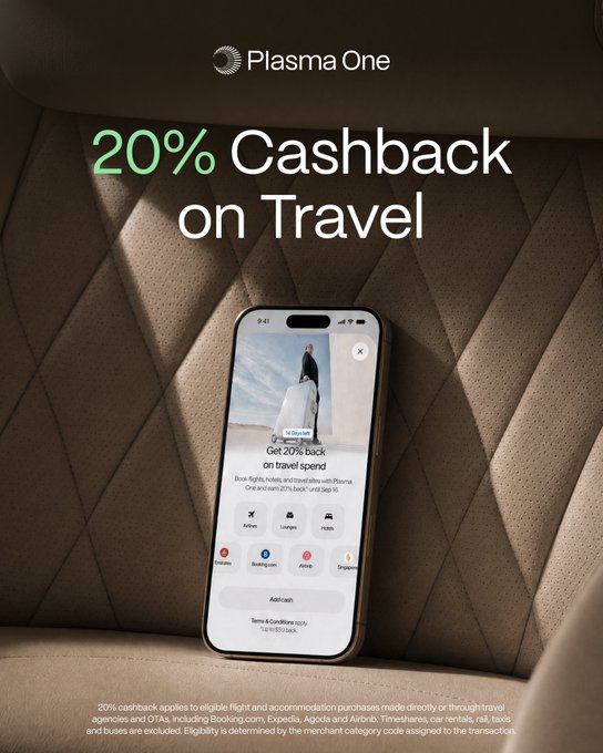 A Plasma One advertisement promoting "20% Cashback on Travel" with a smartphone on a quilted surface showing the app interface for booking flights, hotels, and accommodations.