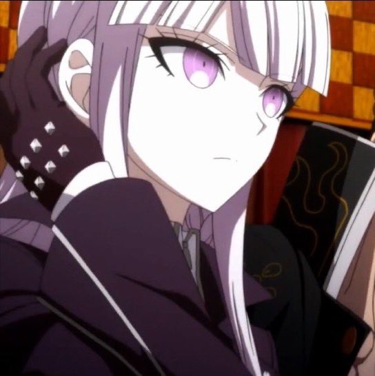 An anime character with white hair, purple eyes, and dark studded clothing looks back over their shoulder, holding a book with a dark cover featuring gold flame designs.