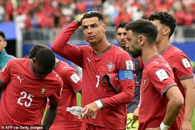 A group of soccer players in red jerseys, including one with the number 7, stand together on a field while holding a water bottle. Visible text includes "AFP via Getty Images," "Football Unites the World," and jersey numbers "23" and "22." The image appears unrelated to the post's discussion about Bitcoin upgrades and post-quantum wallet technology, though the hashtag #CR7 may reference the prominent player (Cristiano Ronaldo) shown.