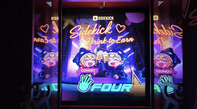 A vibrant neon-lit sign for "Sidekick - Drink to Earn" by Coinhost is displayed, featuring two cheerful cartoon characters in hoodies clinking mugs together beneath a stylized "FOUR" logo. The image reflects the post's nostalgic theme about Sidekick Labs by showcasing the project's brand and "Drink to Earn" tagline, evoking the warm, community-driven atmosphere the former employee describes.