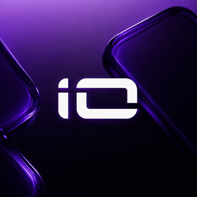 A sleek purple logo featuring a stylized white 'iO' symbol flanked by the curved edges of two smartphones on a dark purple gradient background.