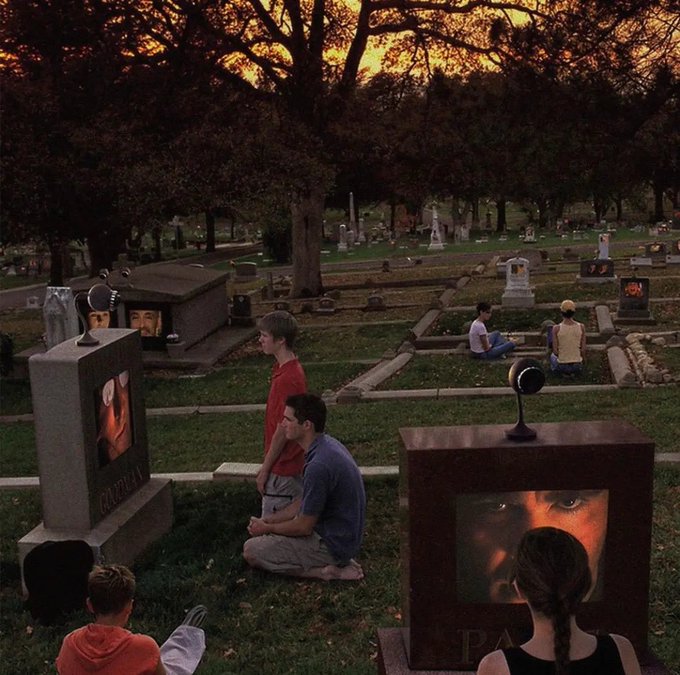 Surreal artistic scene of people in a cemetery at dusk, with gravestones displaying illuminated screens showing faces, as visitors sit and watch the displays.
