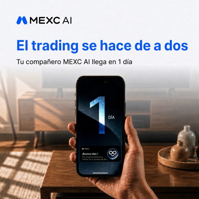 An advertisement for 'MEXC AI' featuring a hand holding a smartphone displaying '1 DÍA' and '¡Buenos días!' on the screen, with the Spanish text 'El trading se hace de a dos' and 'Tu compañero MEXC AI llega en 1 día' above.