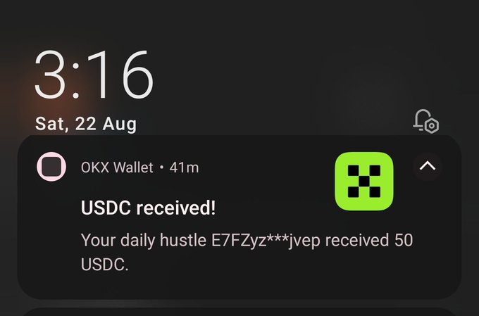 A smartphone lock screen displaying the time 3:16 on Saturday, 22 Aug, with an OKX Wallet notification reading "USDC received! Your daily hustle E7FZyz***jvep received 50 USDC."