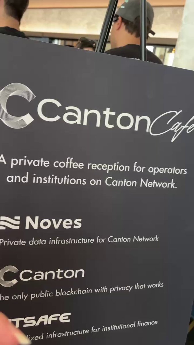 The image shows a sign for Canton Cafe that includes logos of other companies such as @CantonFdn, @BitSafe, and @Noves. The text on the sign indicates that this cafe offers private coffee receptions for operators and institutions on Canton Network.