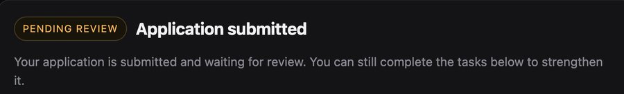 A dark interface banner reading 'PENDING REVIEW - Application submitted' with the message that the application is waiting for review and can be strengthened with additional tasks.