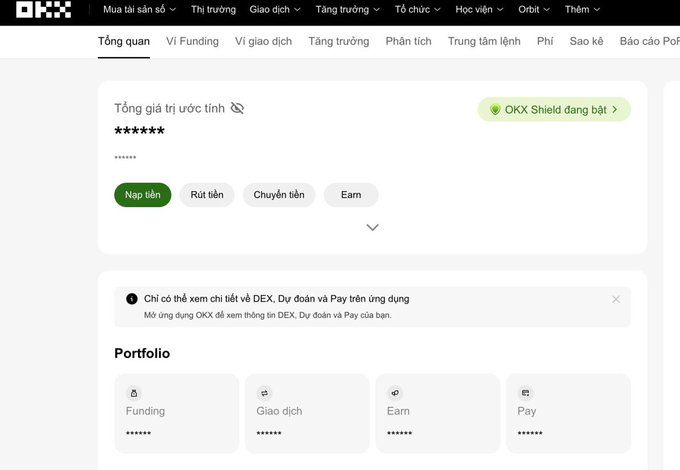 A screenshot of the OKX cryptocurrency exchange website in Vietnamese, showing account overview options like 'Nạp tiền', 'Rút tiền', and 'Chuyển tiền', along with a portfolio menu and 'OKX Shield' status.