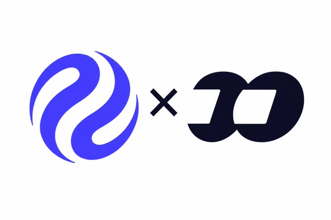 A logo graphic featuring a blue swirling emblem next to a black 'X' and the dark blue stylized letters 'JD'.