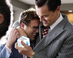 The image shows a man being comforted by another man in a pinstripe suit after receiving a box labeled "Chainlink," a reference to the Chainlink cryptocurrency, playing on the dramatic scene to suggest the crypto's growing influence or dominance.