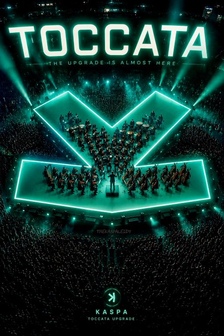A concert stage features an orchestra arranged within a glowing teal arrow-shaped formation, with the bold text "TOCCATA — THE UPGRADE IS ALMOST HERE" and the "KASPA TOCCATA UPGRADE" logo below, symbolizing Kaspa's upcoming network enhancement with native programmability, zk-op support, and expanded possibilities for wallets, DeFi, and applications.